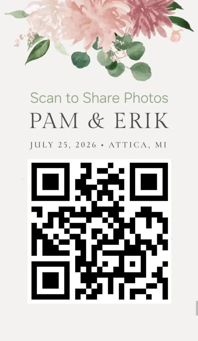 A printed table card at a wedding reading "Scan to Share Photos", with a QR code below it